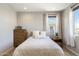 Charming bedroom with a comfortable bed and window seating at 27165 N 71St Ln, Peoria, AZ 85383