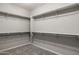 Large walk-in closet with ample shelving and hanging space at 27165 N 71St Ln, Peoria, AZ 85383