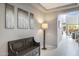 Entryway with a bench, floor lamp and view to the living area at 27165 N 71St Ln, Peoria, AZ 85383