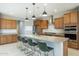 Modern kitchen with island and stainless steel appliances at 27165 N 71St Ln, Peoria, AZ 85383