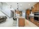 Modern kitchen with large island and stainless steel appliances at 27165 N 71St Ln, Peoria, AZ 85383