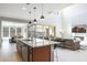 Open concept kitchen with island and stainless steel appliances at 27165 N 71St Ln, Peoria, AZ 85383