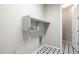 Laundry room with shelving and tile flooring at 27165 N 71St Ln, Peoria, AZ 85383