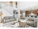Open living room with high ceilings and two sofas at 27165 N 71St Ln, Peoria, AZ 85383