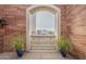 Private balcony with arched window and city views at 30 W Palm Ln, Phoenix, AZ 85003