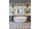 Elegant bathroom with freestanding tub, dual sinks, and marble accents at 30 W Palm Ln, Phoenix, AZ 85003