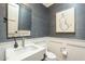 Stylish bathroom with white sink and dark gray walls at 30 W Palm Ln, Phoenix, AZ 85003