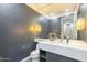 Elegant powder room with stylish wallpaper and modern vanity at 30 W Palm Ln, Phoenix, AZ 85003
