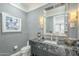 Elegant powder room with dark vanity and marble countertop at 30 W Palm Ln, Phoenix, AZ 85003