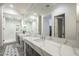 Spa-like bathroom with double vanity, marble countertop, and large shower at 30 W Palm Ln, Phoenix, AZ 85003