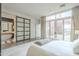 Spacious bedroom with ensuite bathroom and sliding barn door at 30 W Palm Ln, Phoenix, AZ 85003