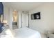 Bright bedroom with a large bed, ensuite bathroom access, and city views at 30 W Palm Ln, Phoenix, AZ 85003