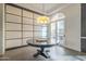 Elegant dining room with a round table, chandelier, and access to a balcony at 30 W Palm Ln, Phoenix, AZ 85003