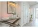 Elegant entryway with a console table, modern lighting, and hardwood floors at 30 W Palm Ln, Phoenix, AZ 85003