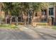 Brick building exterior with gated entrance and landscaping at 30 W Palm Ln, Phoenix, AZ 85003