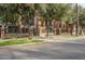 Brick building exterior with lush landscaping and gated entrance at 30 W Palm Ln, Phoenix, AZ 85003