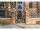 Brick building with ornate iron gate and landscaping at 30 W Palm Ln, Phoenix, AZ 85003