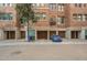 View of building exterior, garages, and parking at 30 W Palm Ln, Phoenix, AZ 85003
