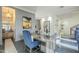 Spacious home office features wood desk, blue chairs, and large artwork at 30 W Palm Ln, Phoenix, AZ 85003