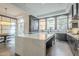 Modern kitchen with marble countertops, stainless steel appliances and large windows at 30 W Palm Ln, Phoenix, AZ 85003