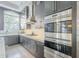 Modern kitchen with stainless steel appliances and dark cabinetry at 30 W Palm Ln, Phoenix, AZ 85003