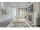 Spacious living area with hardwood floors, fireplace and large windows at 30 W Palm Ln, Phoenix, AZ 85003