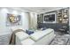 Relaxing media room with white sectional and built-ins at 30 W Palm Ln, Phoenix, AZ 85003