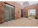 Spacious patio with city views and brick walls at 30 W Palm Ln, Phoenix, AZ 85003