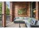 Brick patio with comfortable seating and artwork at 30 W Palm Ln, Phoenix, AZ 85003