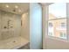 Large walk-in shower with marble tile and glass enclosure at 30 W Palm Ln, Phoenix, AZ 85003