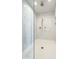 Spacious walk-in shower with marble tile and rain shower head at 30 W Palm Ln, Phoenix, AZ 85003