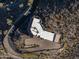 Overhead view of a unique house with a flat roof and desert landscaping at 37300 N School House Rd, Cave Creek, AZ 85331