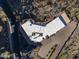Overhead view of a unique house with a flat roof and desert landscaping at 37300 N School House Rd, Cave Creek, AZ 85331