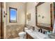 Stylish bathroom features marble vanity and a large window at 37300 N School House Rd, Cave Creek, AZ 85331