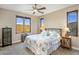 Bedroom with mountain views and floral bedding at 37300 N School House Rd, Cave Creek, AZ 85331