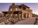 Mountain contemporary home with stone accents and covered patio at 37300 N School House Rd, Cave Creek, AZ 85331