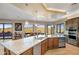 Gourmet kitchen boasts granite counters, stainless steel appliances, and island at 37300 N School House Rd, Cave Creek, AZ 85331