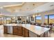 Open kitchen features granite island, stainless steel appliances, and mountain views at 37300 N School House Rd, Cave Creek, AZ 85331