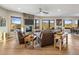 Open living room with stone fireplace and expansive windows at 37300 N School House Rd, Cave Creek, AZ 85331