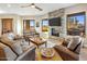 Comfortable living room with leather furniture and mountain views at 37300 N School House Rd, Cave Creek, AZ 85331