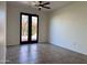 Bright bedroom with double doors leading to the backyard at 4041 S Prairie Zinnia Dr, Gold Canyon, AZ 85118