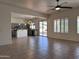 Open concept kitchen and dining area with modern gray cabinets and island at 4041 S Prairie Zinnia Dr, Gold Canyon, AZ 85118