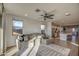 Spacious living room with L-shaped sectional sofa and views into the kitchen area at 4428 N 92Nd Ln, Phoenix, AZ 85037