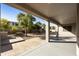 Relaxing covered patio offering backyard views with mature trees and brick patio detail at 4615 W Corral Rd, Laveen, AZ 85339