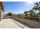 Balcony with railing, views of the neighborhood, mountains, and palm trees on a sunny day at 4615 W Corral Rd, Laveen, AZ 85339