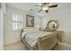 Inviting bedroom with a light-colored bed, neutral decor, and bright window at 4615 W Corral Rd, Laveen, AZ 85339