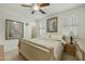 Comfortable bedroom with a sleek bed, window with shutters, and neutral color scheme at 4615 W Corral Rd, Laveen, AZ 85339