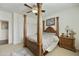 Spacious bedroom with a four-poster bed, ceiling fan, and elegant furnishings at 4615 W Corral Rd, Laveen, AZ 85339