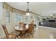 Dining area with a wood table, chairs, and natural light from the window at 4615 W Corral Rd, Laveen, AZ 85339