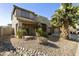 Beautiful two-story home showcasing desert landscaping and a spacious, shaded front porch at 4615 W Corral Rd, Laveen, AZ 85339